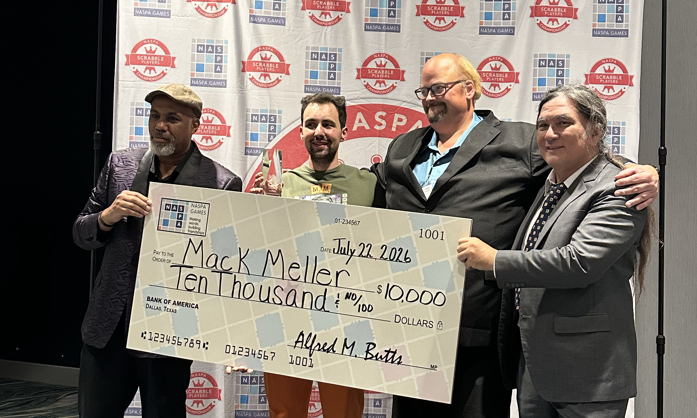 Photo of Scrabble Players Champion Mack Meller with presentation check